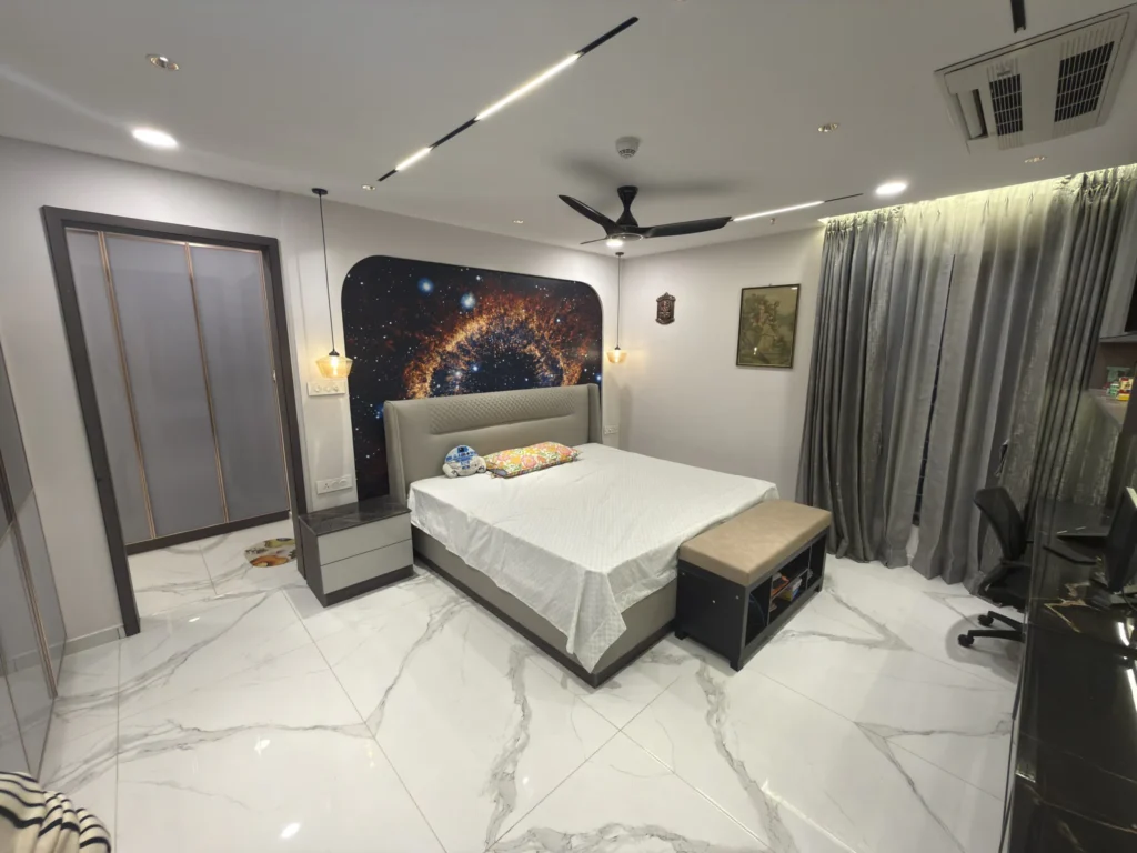 Simple bedroom interior with a bed, furniture, and clean minimalist décor