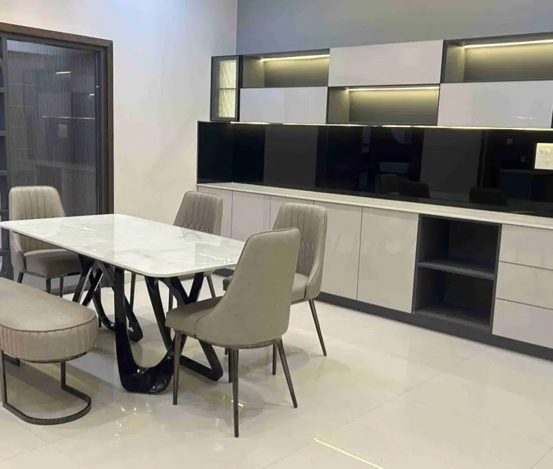 modern dining room featuring a stylish dining table, built-in storage cabinets, and functional contemporary déco