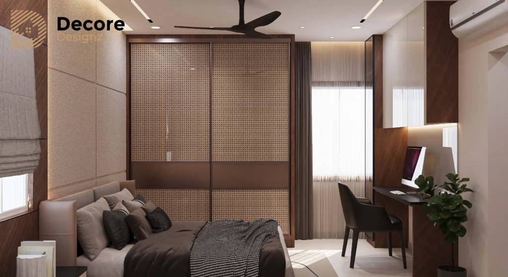3 BHK Modern bedroom featuring a study unit by the window, built-in wardrobe, and sleek contemporary furnishings.