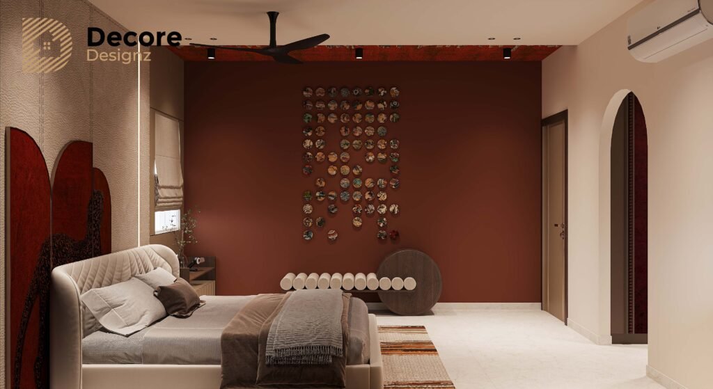 Luxury Bedroom Interior Design in Hyderabad: A Warm, Modern Master Bedroom 4 Modern bedroom with a rich terracotta accent wall, a vertical wall-plate art installation, custom upholstered bed, arched doorway, and unique bench seating.